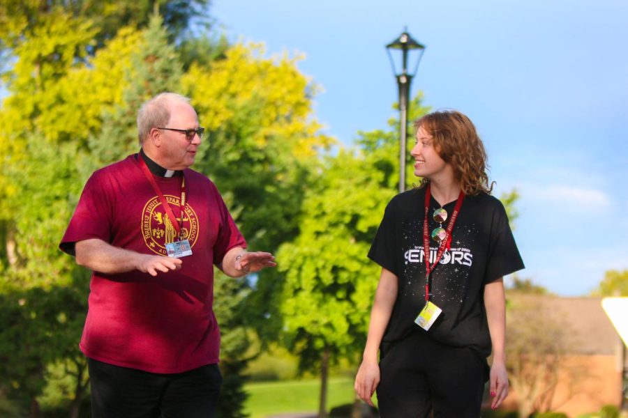 Fr. Bill walks with Grace Erickson