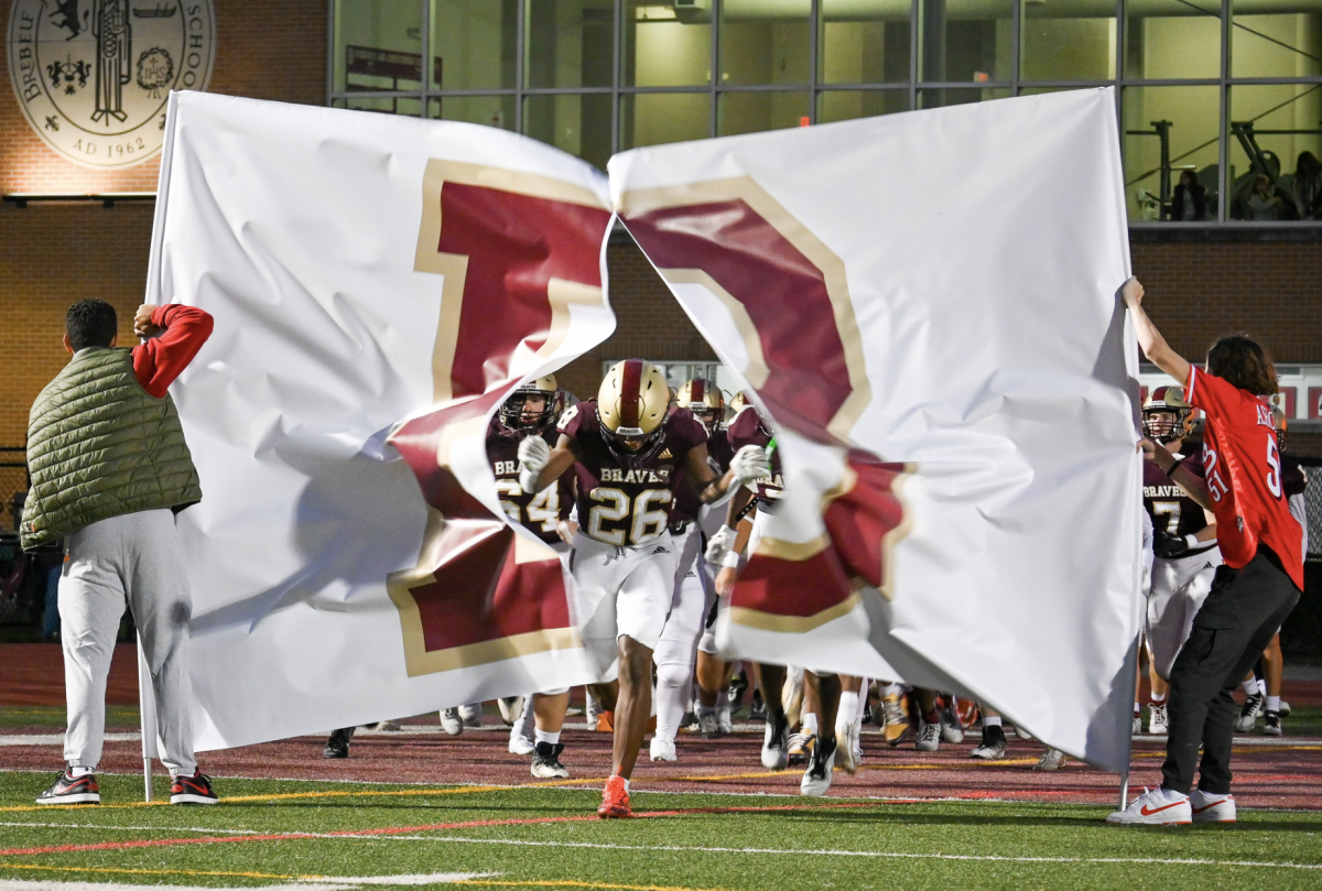 Javawn Brooks '24 leads the Braves out of the tunnel in last week's 48-27 win over Terre Haute North. This week, Brooks had a momentum-swinging third quarter interception that was the only takeaway of the game.