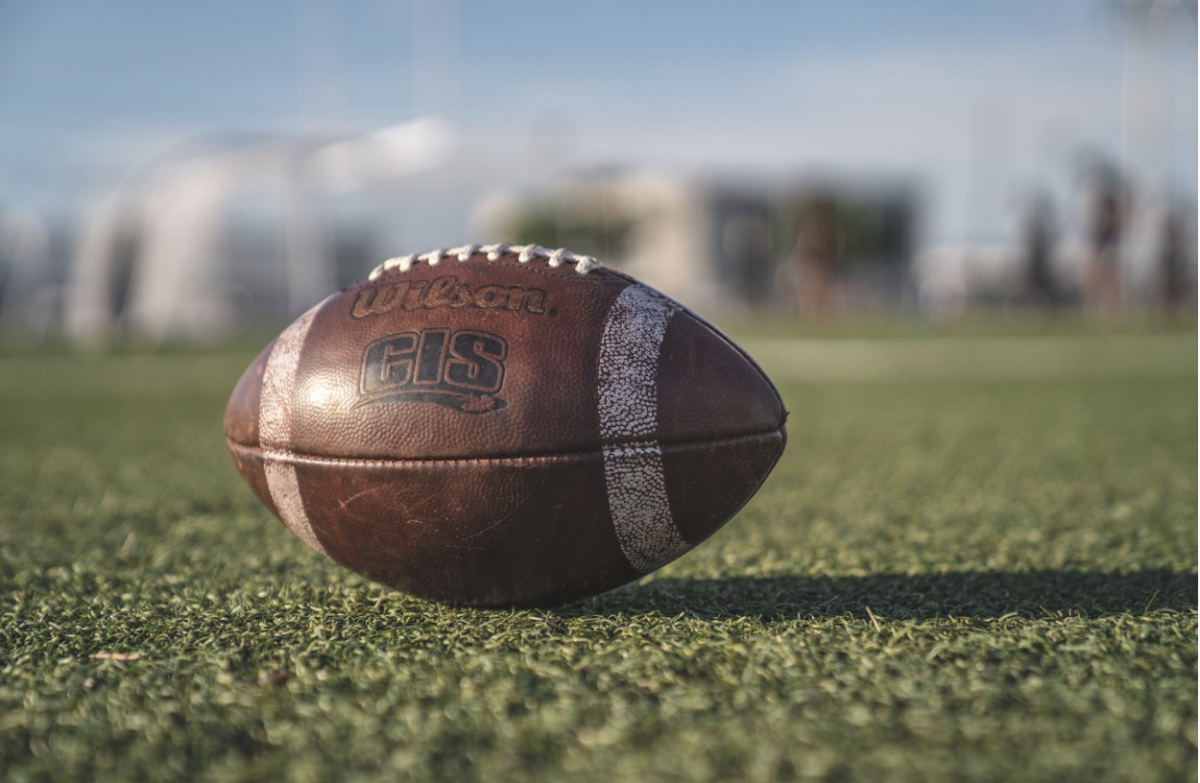 Football Rests on Field