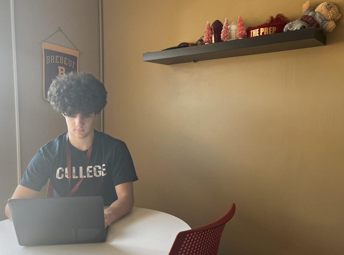 Tom Weintraut ‘27 works on an assignment during a PRT detention in the Dean's Office.