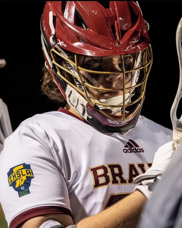 Defenseman Peyton Cummings prepares for a game against rivals Bishop Chatard. Brebeuf went on to win 15-3.