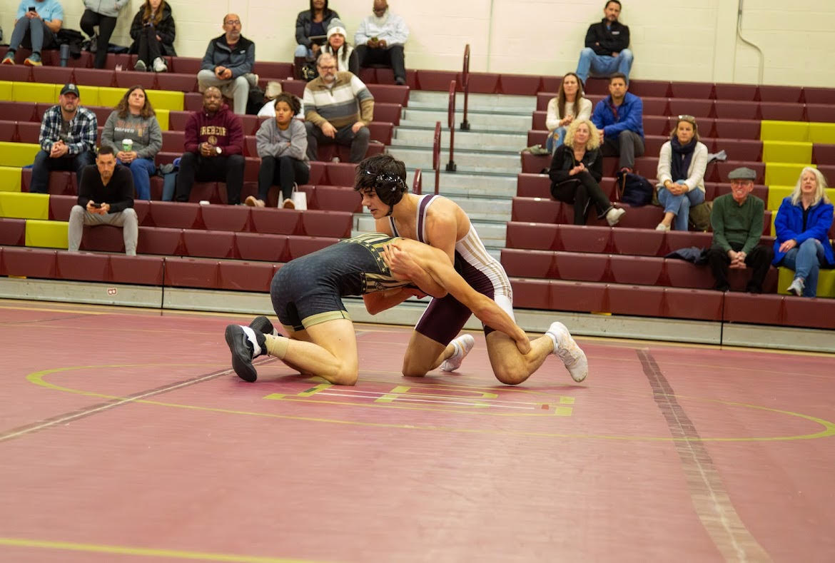 Sophomore Tarun Konakondla duels a Purdue Polytechnic wrestler in the 150 pound weight class. 

